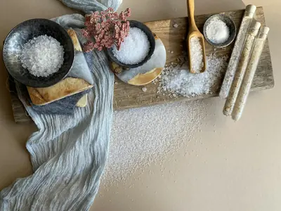Sea salt scrub in bowls on a wooden board