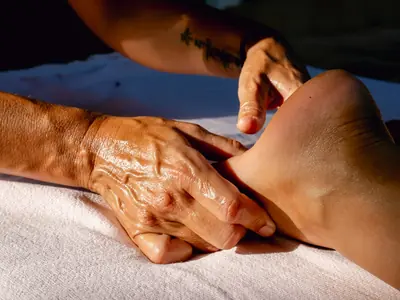 Thumb pressure on the sole of the foot
